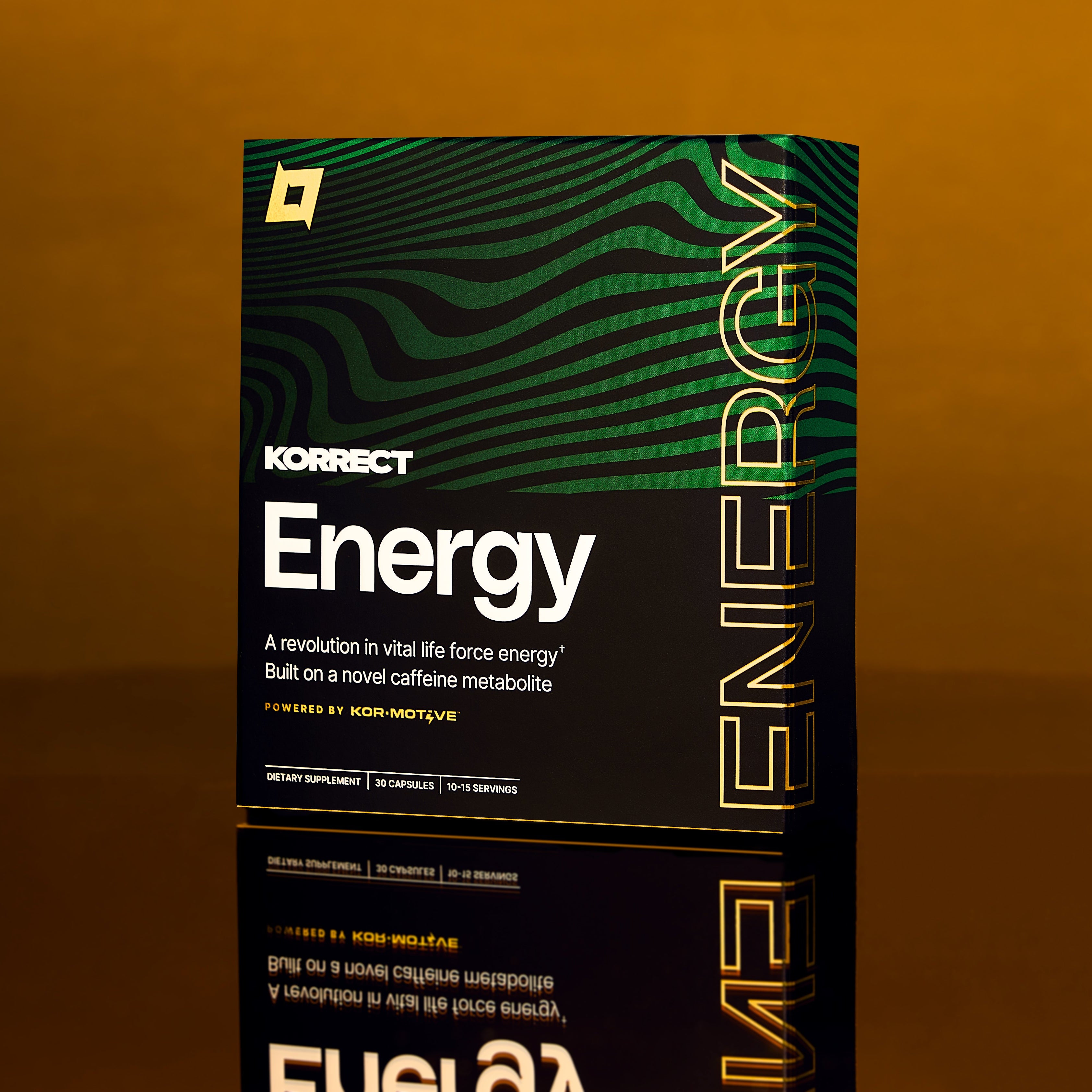 KORRECT Energy supplement box on a reflective surface with a brown background